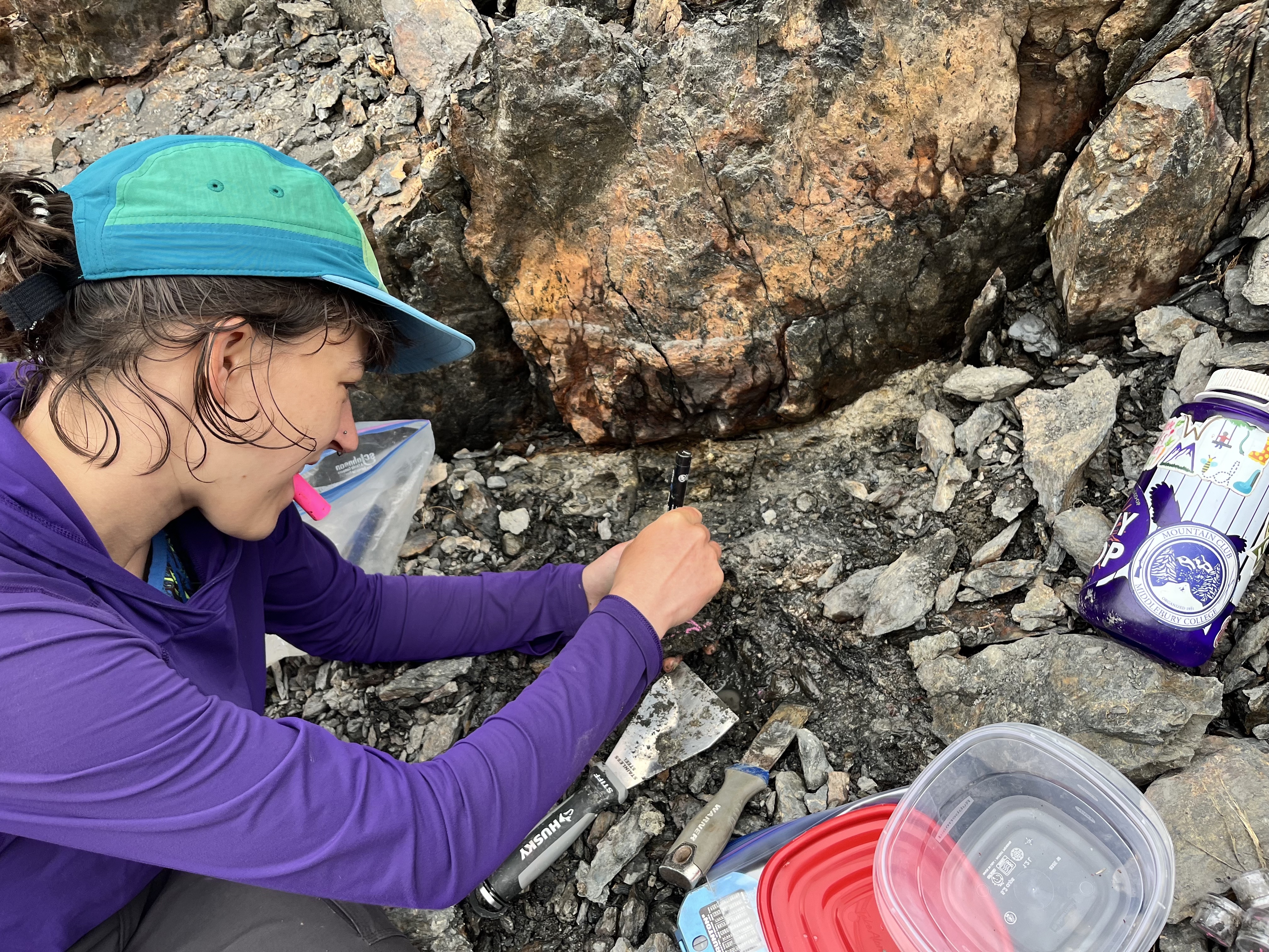 Sampling soft clay fault gouge in a fault strand at Lake of the Gods, Olympic National Park.